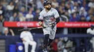 Minnesota Twins' Carlos Santana (30) watches the ball fly as he hits a solo home run against the Toronto Blue Jays during fifth inning MLB baseball action in Toronto on Friday, May 10, 2024. THE CANADIAN PRESS/Cole Burston