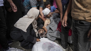 Palestinians mourn relatives killed in the Israeli bombardments of the Gaza Strip. (Abdel Kareem Hana/AP Photo)