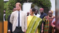 Prince Harry, left, and Meghan, right, holding hands upon arrival at the government house in Lagos Nigeria, Sunday, May 12, 2024. Prince Harry and his wife Meghan are in Nigeria to champion the Invictus Games, which Prince Harry founded to aid the rehabilitation of wounded and sick servicemembers and veterans. (AP Photo/Sunday Alamba)