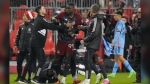 On Saturday night, Toronto FC and New York City FC offered definitive proof of their bad blood in an ill-tempered affair that featured seven yellow cards, one red and an ugly post-game melee that is likely to trigger additional discipline. Toronto FC forward Prince Osei Owusu (99) is restrained by team staff members after MLS action against New York City in Toronto, Saturday, May 11, 2024. THE CANADIAN PRESS/Frank Gunn