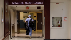 A nurse walks through a hallway at Sunnybrook Health Sciences Centre’s Schulich Heart Centre in Toronto, Monday, Jan. 30, 2023. THE CANADIAN PRESS/Cole Burston