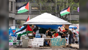 A tent with free supplies is seen at the pro-Palestinian encampment on McGill University campus Monday, May 6, 2024, in Montreal. Lawyers for McGill University are seeking a court injunction to dismantle the pro-Palestinian encampment that has been erected on its grounds since last month. THE CANADIAN PRESS/Ryan Remiorz