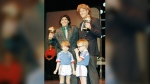 FILE - Argentina's soccer star Diego Maradona, left, and West German goalkeeper Harald Schumacher are holding their World Cup Soccer Ball awards while posing with two young soccer players during the Soccer Golden Shoe Award ceremony held in Paris, France, on Nov. 13, 1986. A trophy won by the late Diego Maradona for the best player at the 1986 World Cup that had mysterioulsy disappeared has resurfaced. It will be auctioned in Paris next month, the Aguttes house said on Tuesday May 7, 2024. (AP Photo/Michael Lipchitz, File)