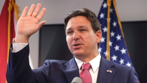 Florida Gov. Ron DeSantis thanks supporters after signing House bill 621 that protects homeowners and their property against squatting —the illegal possession of vacant homes— during a ceremony at the Ninth Judicial Circuit state attorney's office in Orlando, Wednesday, March 27, 2024. (Joe Burbank/Orlando Sentinel via AP)