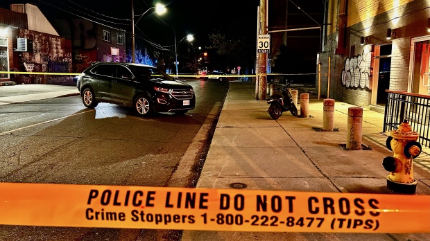 Police tape cordons off the scene where an unmarked police vehicle collided with a motorized scooter on Niagara Street Thursday May 16, 2024. (Mike Nguyen)