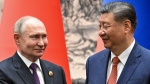 Chinese President Xi Jinping, right, and Russian President Vladimir Putin look toward each other as they shake hands prior to their talks in Beijing, China, on Thursday, May 16, 2024. (Sergei Bobylev, Sputnik, Kremlin Pool Photo via AP)