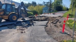 Crews repair a road that was damaged during a major flood in Bancroft on May 15. (Harrison Perkins/CTV News Toronto)