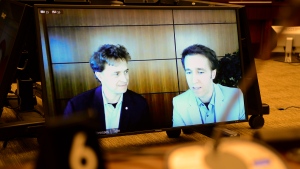 A defamation lawsuit filed by the mother of Marc and Craig Kielburger against the Canadaland podcast and its host will head to trial after an Ontario court rejected an application to have it thrown out, finding the claim has "substantial merit." Marc Kielburger, screen left, and Craig Kielburger, screen right, appear as witnesses via videoconference during a House of Commons finance committee in the Wellington Building in Ottawa, Tuesday, July 28, 2020. THE CANADIAN PRESS/Sean Kilpatrick
