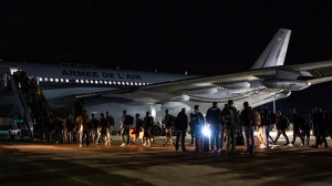This handout photo provided by the French Army shows security force embarking a plane to New Caledonia at the Istres military base, southern France, on Thursday, May 16, 2024.  (Etat Major des Armees via AP, File)