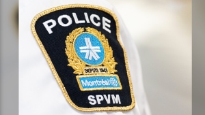 A 55-year-old woman is dead and her former partner is facing charges in what police say is Montreal's 13th homicide of the year. A Montreal police badge is shown during a news conference, in Montreal, Thursday, Aug. 4, 2022. THE CANADIAN PRESS/Graham Hughes