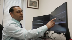Dr. Roneil Malkani shows an example of pink noise being used to enhance slow brainwaves during deep sleep at the Center for Circadian & Sleep Medicine at Northwestern Medicine in Chicago on May 16, 2024. (AP Photo/Laura Bargfeld)