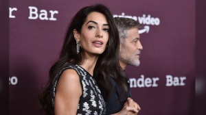 FILE - Amal Clooney, left, and George Clooney arrive at a screening of "The Tender Bar," Oct. 3, 2021, at the Directors Guild of America in Los Angeles. Amal Clooney is one of the legal experts who recommended that the world's top war crimes court seek arrest warrants for Israeli Prime Minister Benjamin Netanyahu and leaders of the militant Hamas group, Clooney announced Monday, May 20, 2024. (Photo by Richard Shotwell/Invision/AP, File)