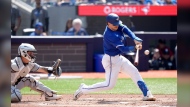 Toronto Blue Jays catcher Danny Jansen (9) hits an RBI double during third inning MLB baseball action against the Chicago White Sox, in Toronto, Monday, May 20, 2024. THE CANADIAN PRESS/Chris Young