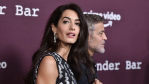 Amal Clooney, left, and George Clooney are seen Oct. 3, 2021, at the Directors Guild of America in Los Angeles. (Photo by Richard Shotwell/Invision/AP, File)