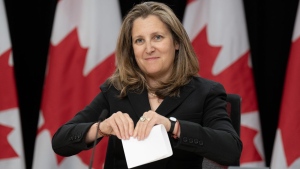 Deputy Prime Minister and Minister of Finance Chrystia Freeland folds a piece of paper after delivering her opening remarks at a news conference, Tuesday, May 21, 2024 in Ottawa. THE CANADIAN PRESS/Adrian Wyld