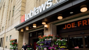 FILE - A woman leaves a Loblaws store in Toronto on Thursday, May 3, 2018. THE CANADIAN PRESS/Nathan Denette 
