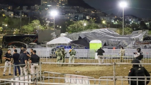 Security forces stand around a stage that collapsed due to a gust of wind during an event attended by presidential candidate Jorge Álvarez Máynez in San Pedro Garza García, on the outskirts of Monterey, Mexico, Wednesday, May 22, 2024. (Alberto Lopez / AP Photo)
