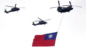 Helicopters fly during an inauguration celebration of Taiwan's President Lai Ching-te in Taipei on May 20, 2024.  (Chiang Ying-ying / AP Photo)