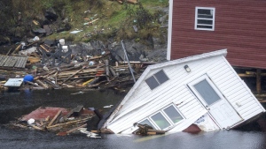Buildings sit in the water along the shore following hurricane Fiona in Rose Blanche-Harbour le Cou, N.L. on Tuesday, Sept. 27, 2022. THE CANADIAN PRESS/Frank Gunn