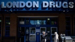 London Drugs says some files stolen during a cybersecurity breach have now been released by "cybercriminals." People wait outside of the London Drugs Kerrisdale location on Monday, April. 29, 2024. THE CANADIAN PRESS/Ethan Cairns