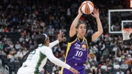 L.A. Sparks' Kia Nurse, of Hamilton, Ont., is hoping that a new WNBA franchise awarded to Toronto, set to debut in the league's 2026 season, will have the same impact on Canadian girls and women as Vince Carter did more than 20 years ago. Nurse (10) makes the pass as Seattle Storm's Victoria Vivians (35) tries to block during second half WNBA pre-season action in Edmonton, Saturday, May 4, 2024. THE CANADIAN PRESS/Jason Franson