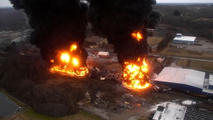FILE - This image take from drone video taken by the Columbiana County Commissioner's Office and released by the NTSB shows towering flames and columns of smoke resulting from a "vent and burn" operation following the train derailment in East Palestine, Ohio, on Feb. 6, 2023. (Columbiana County Commissioner's Office/NTSB via AP, File)