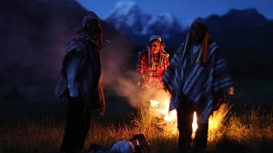 FILE - Andean farmers take part in a ceremony honoring Mother Earth and Father Snowy Mountain, in Pitumarca, Peru, April 4, 2018. (AP Photo/Martin Mejia, File)