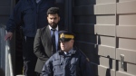 Jaskirat Singh Sidhu is taken out of the Kerry Vickar Centre by the RCMP following his sentencing for the crash, in Melfort, Sask., Friday, March 22, 2019. THE CANADIAN PRESS/Kayle Neis