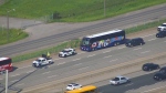 A coach bus is seen with a shattered windshield after being struck by a flying wheel on the QEW on Friday, May 24, 2024. (Chopper24)
