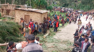 In this photo provides the International Organization for Migration, an injured person is carried on a stretcher to seek medical assistance after a landslide in Yambali village, Papua New Guinea, Friday, May 24, 2024. (Benjamin Sipa/International Organization for Migration via AP)