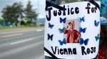 A poster can be seen taped to a telephone pole at a rally held for the late Vienna Irwin in Cobourg, Ont. on May 25, 2024. (CTV News Toronto)