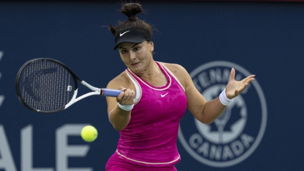 Bianca Andreescu hits a return to Camila Giorgi of Italy, during the National Bank Open tennis tournament in Montreal, Tuesday, August 8, 2023. THE CANADIAN PRESS/Christinne Muschi