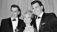 FILE - In this April, 5,1965 file photo actress Debbie Reynolds poses with Academy awards winners for best music Richard M. Sherman, right and Robert Sherman, left, who received the award for Mary Poppins in Santa Monica Calif. Songwriter Sherman, who wrote the tongue-twisting "Supercalifragilisticexpialidocious" and other enduring songs for Disney classics, has died. He was 86. (AP Photo,File) 