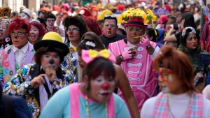 Clowns march celebrating The Day of the Peruvian Clown, in downtown Lima, Peru, Saturday, May 25, 2024. (AP Photo/Martin Mejia)