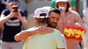 Serbia's Novak Djokovic greets Spain's Rafael Nadal after Nadal's training session at the Roland Garros stadium, Saturday, May 25, 2024 in Paris. (AP Photo/Jean-Francois Badias)