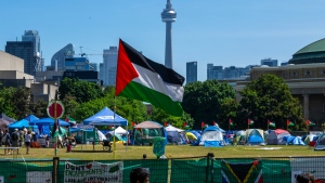A Palestinian flag flies over the pro-Palestinian encampment set up at the University of Toronto campus in Toronto on Sunday, May 26, 2024. (Frank Gunn / THE CANADIAN PRESS)
