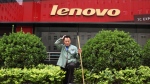 A cleaner works near an empty store of Chinese computer manufacturer Lenovo at a district selling computer products in Beijing, China on Wednesday, May 15, 2019. THE CANADIAN PRESS/AP /Ng Han Guan
