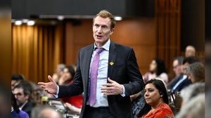 Immigration Minister Marc Miller is lifting the cap on Palestinian who can be brought by relatives to Canada through a program that faces widespread criticism. Miller rises during Question Period in the House of Commons on Parliament Hill in Ottawa on Monday, May 27, 2024. THE CANADIAN PRESS/Justin Tang