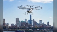 A new report finds that Canadians feel both "optimism and concern" over the prospect of flying cars and drones whizzing between remote communities and above city blocks. The Volocopter 2X, an electric vertical takeoff and landing (eVTOL) aircraft, flies during a demonstration of eVTOLs in a test flight, in New York, Monday, Nov. 13, 2023. THE CANADIAN PRESS/AP-Bebeto Matthews