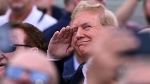 Former U.S. President Donald Trump salutes prior to a NASCAR Cup Series auto race at Charlotte Motor Speedway, Sunday, May 26, 2024, in Concord, N.C. (Matt Kelley / AP Photo)