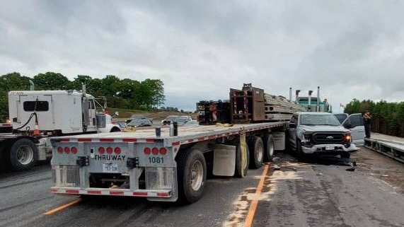 The occupants of a stolen pickup truck collided with two transport trucks on Highway 400 north of Toronto on Tuesday morning. (@OPP_HSD/ X) 