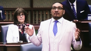 NDP MPP Sol Mamakwa is seen on the screens in the broadcast centre at the Ontario Legislature, as his speech is translated from Oji-Cree to English, in Toronto on Tuesday, May 28, 2024, the first time in history that Indigenous language has been used in the provincial legislature to ask a question of the government. THE CANADIAN PRESS/Chris Young