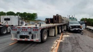 The occupants of a stolen pickup truck collided with two transport trucks on Highway 400 north of Toronto on Tuesday morning. (@OPP_HSD/ X) 