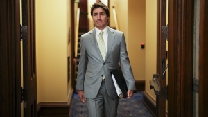 Prime Minister Justin Trudeau makes his way to talk to reporters in the foyer of the House of Commons on Parliament Hill in Ottawa on Tuesday, May 28, 2024. THE CANADIAN PRESS/Sean Kilpatrick