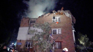 Firefighters put out a fire an apartment building damaged in the Russian missile attack in Kharkiv, Ukraine, Friday, May, 31, 2024. (AP Photo/Andrii Marienko)
