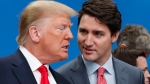 FILE - U.S. President Donald Trump, left, and Canadian Prime Minister Justin Trudeau talk prior to a NATO round table meeting at The Grove hotel and resort in Watford, Hertfordshire, England, Wednesday, Dec. 4, 2019. (AP Photo/Frank Augstein) 