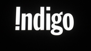An Indigo bookstore sign is illuminated on a store front in Ottawa, Tuesday, March 30, 2021. THE CANADIAN PRESS/Adrian Wyld