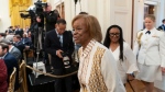 Former first lady Michelle Obama's mother Marian Robinson, centre, arrives for a ceremony in the East Room of the White House in Washington, Wednesday, Sept. 7, 2022. (AP Photo/Andrew Harnik)