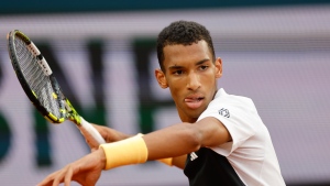 Canada's Felix Auger-Aliassime plays a shot against Ben Shelton of the U.S. during their third round match of the French Open tennis tournament at the Roland Garros stadium in Paris, Saturday, June 1, 2024. (The Canadian Press/AP-Jean-Francois Badias)