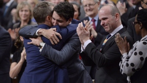 Prime Minister Justin Trudeau hugs Veteran's Affairs Minister Seamus O'Regan after making a formal apology to individuals harmed by federal legislation, policies, and practices that led to the oppression of and discrimination against LGBTQ2 people in Canada, in the House of Commons in Ottawa, Tuesday, Nov.28, 2017.THE CANADIAN PRESS/Adrian Wyld